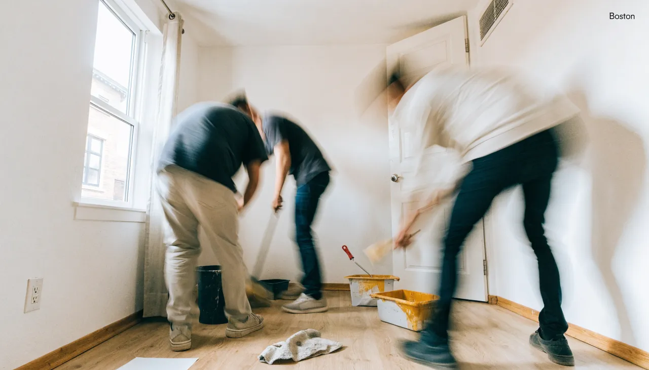 Maintenance crew quickly cleaning and touching up paint during a Boston rental unit turnover